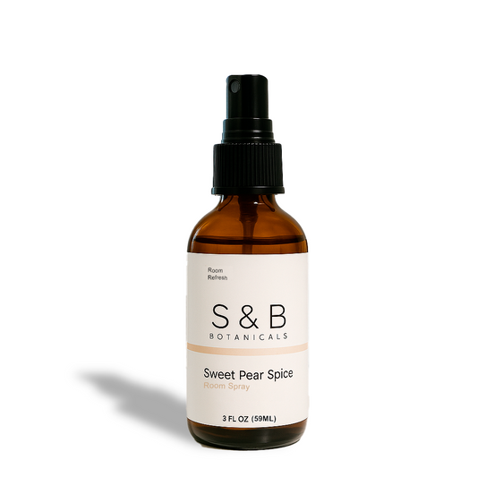 S&B Botanicals Room Spray in amber glass bottle with black pump and white label on clean white background, 2oz phthalate-free water-based clean home fragrance mist