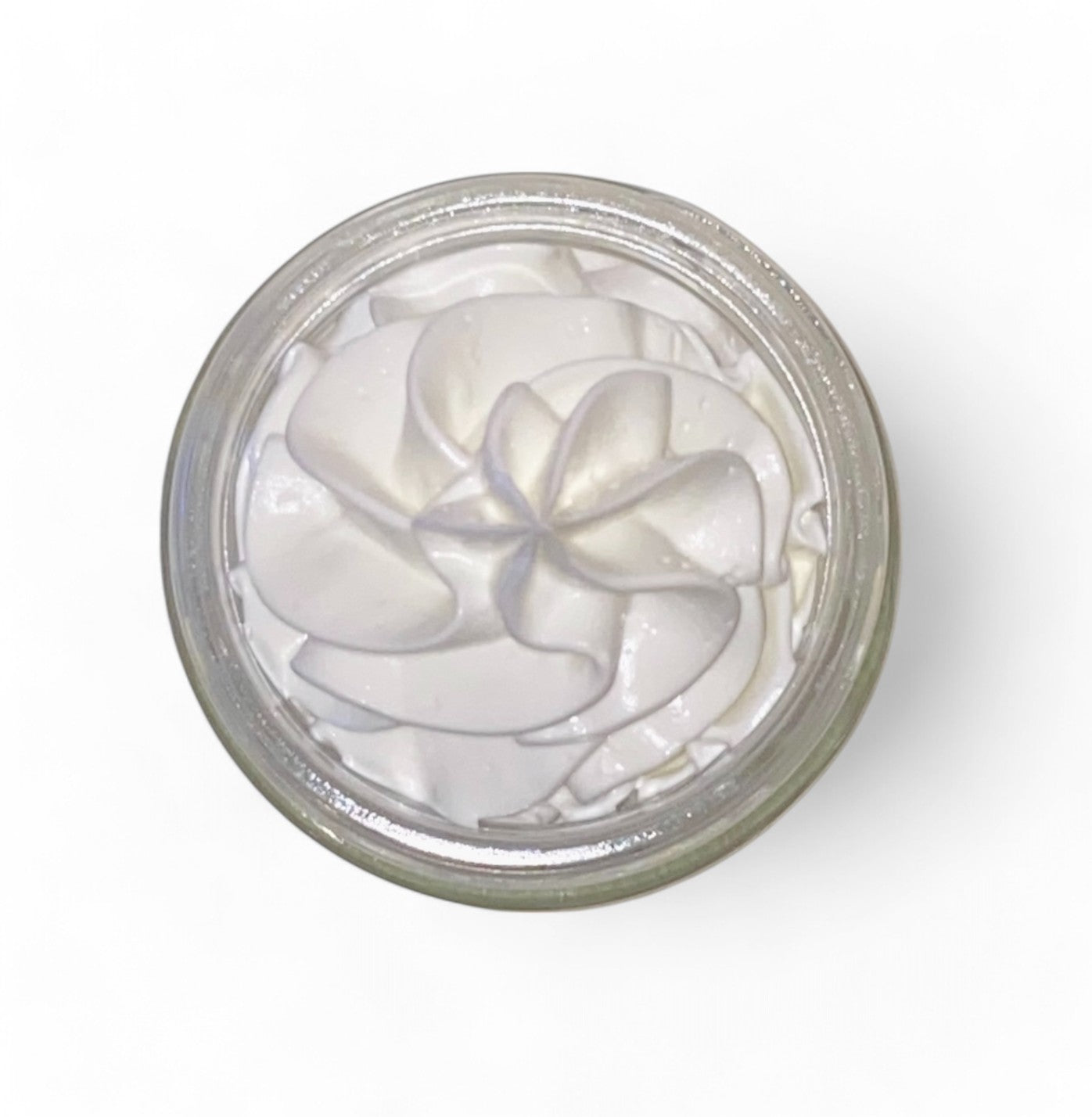 Close-up of calendula body butter showing whipped texture and smooth non-greasy herbal moisturizer consistency