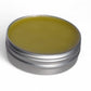 Applying calendula salve to skin for moisturizing dry areas like hands, elbows, and cuticles