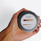 Close-up of comfrey salve label on 2 oz tin from S&B Botanicals herbal skincare