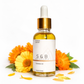 Hydrating calendula botanical face oil being applied to skin