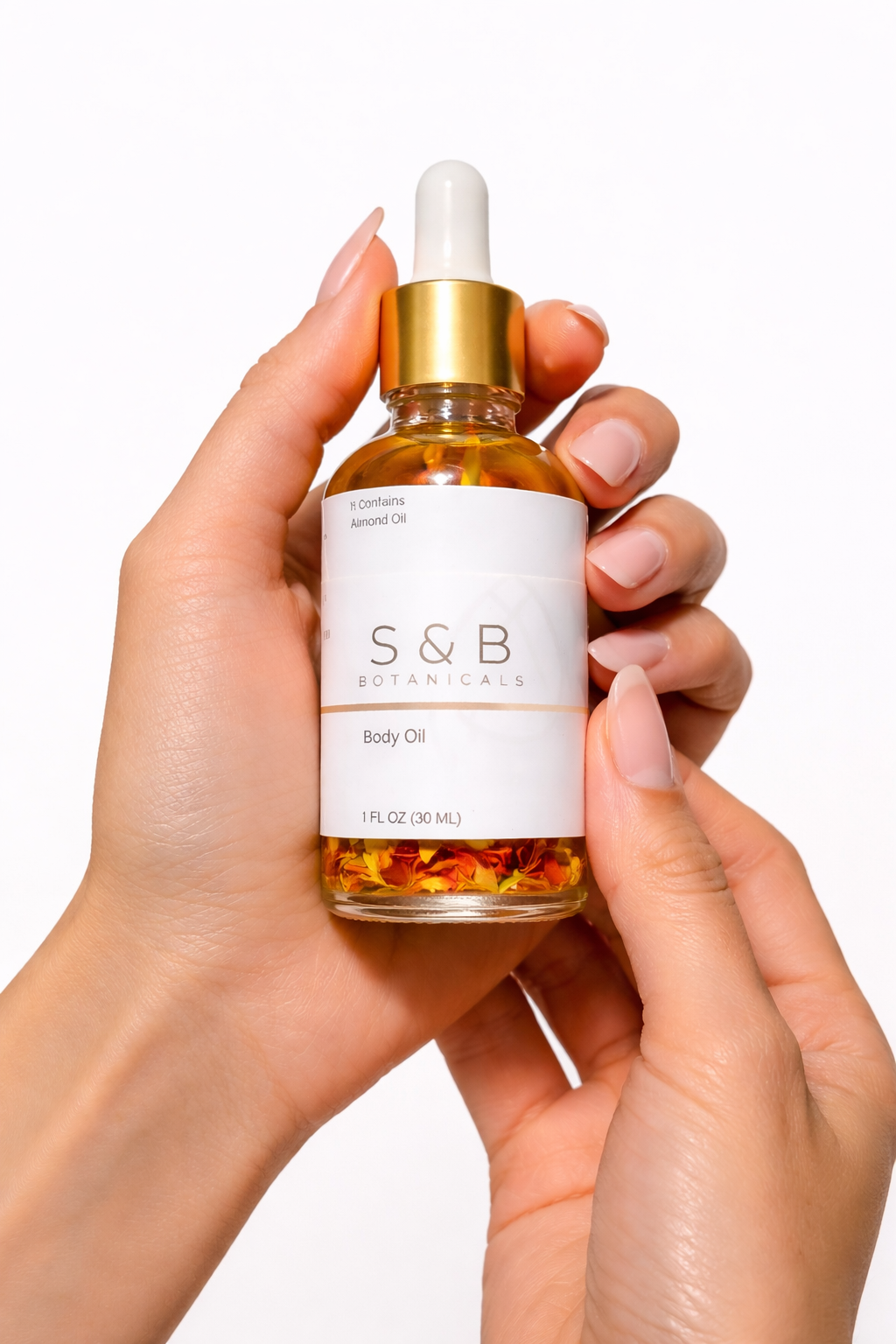Hand holding lavender body oil dropper bottle natural botanical skincare oil for soft glowing skin