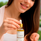 Rosemary peppermint hair oil dropper showing lightweight botanical oil texture for scalp and hair
